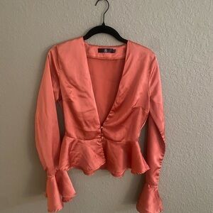 Bronzey/burnt orange colored shirt. Satin, plunge neck, in like new condition.